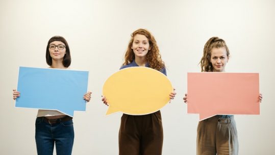 https://www.pexels.com/photo/three-women-holding-bubble-text-cards-3184401/