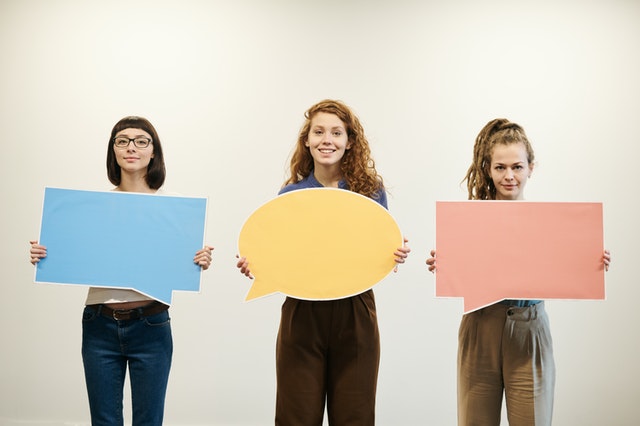 https://www.pexels.com/photo/three-women-holding-bubble-text-cards-3184401/